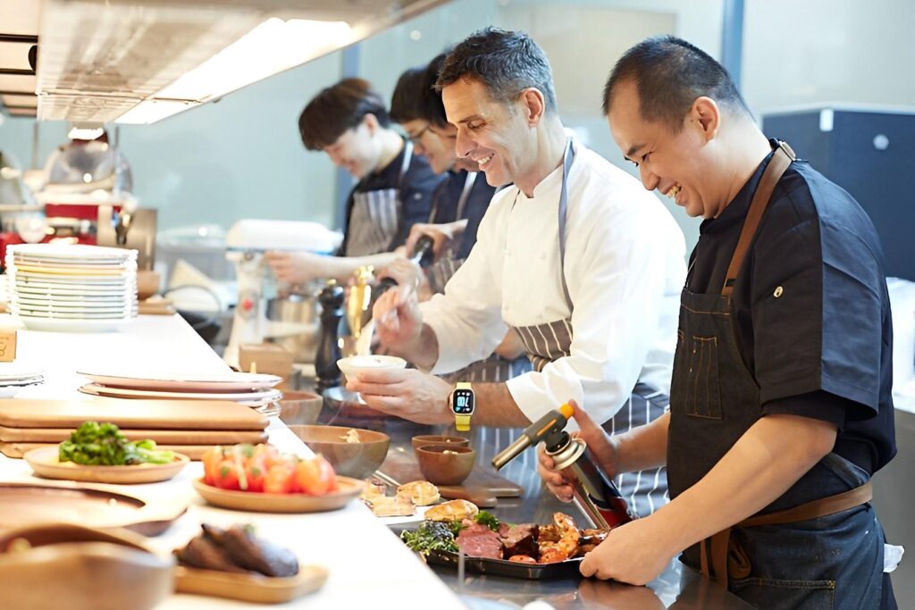 Chef Michael plating with the team